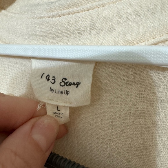 Cream colored boutique button down shirt. Can be worn open or buttoned. - Picture 2 of 2